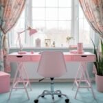 A pastel-themed home office features a pink desk with a matching lamp, a white chair, floral curtains, and a potted plant, creating a cozy and inviting atmosphere.