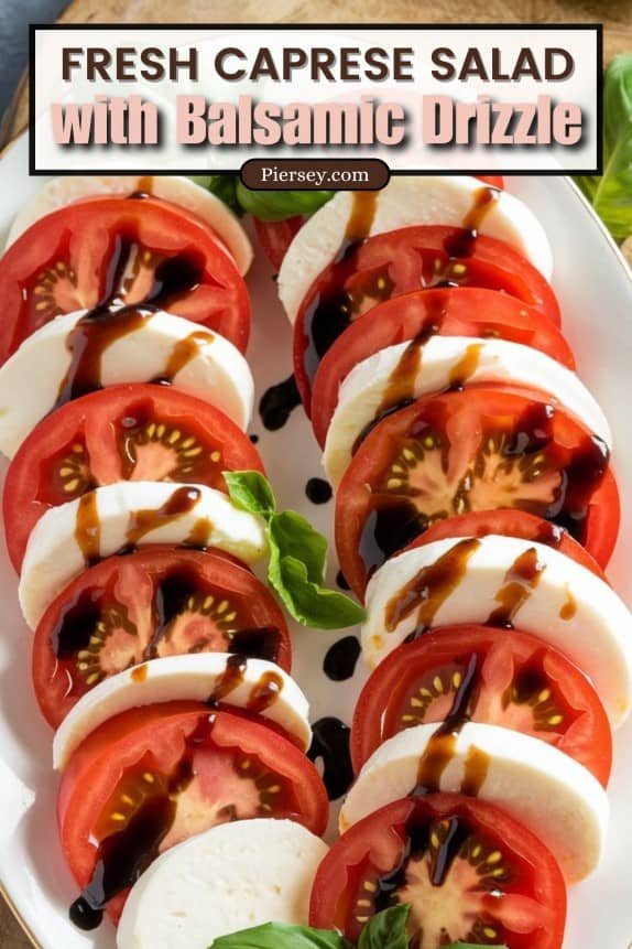 Fresh Caprese salad with alternating slices of tomato and mozzarella, drizzled with balsamic glaze, garnished with basil leaves.