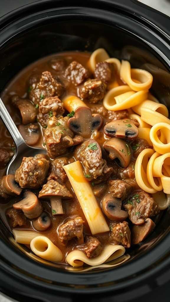 A delicious bowl of beef and mushroom stroganoff with pasta.