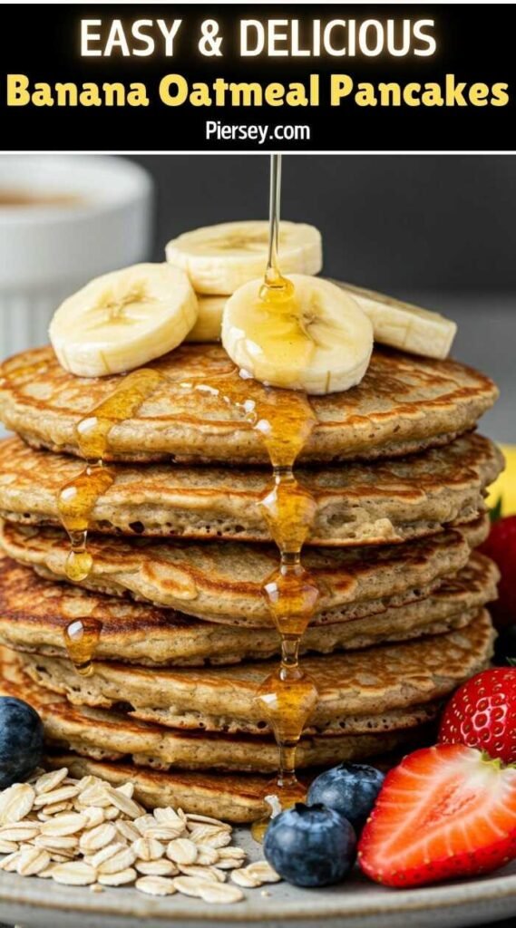 Stack of banana oatmeal pancakes topped with banana slices and drizzled with syrup. Surrounded by fresh strawberries, blueberries, and oats, conveying a delicious breakfast.