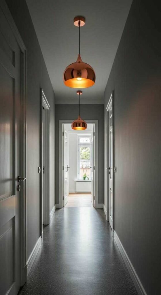 A beautifully lit hallway featuring a prominent pendant light with warm hues.