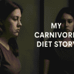 How a Carnivore Diet Gave Me Fatty Liver (and What I Learned) A woman in a gray shirt looks at her reflection in a mirror with a serious expression. The text reads "My Carnivore Diet Story," suggesting introspection.